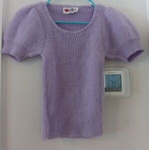 A 1980s puffy sleeve sweater I do believe it's cashmere